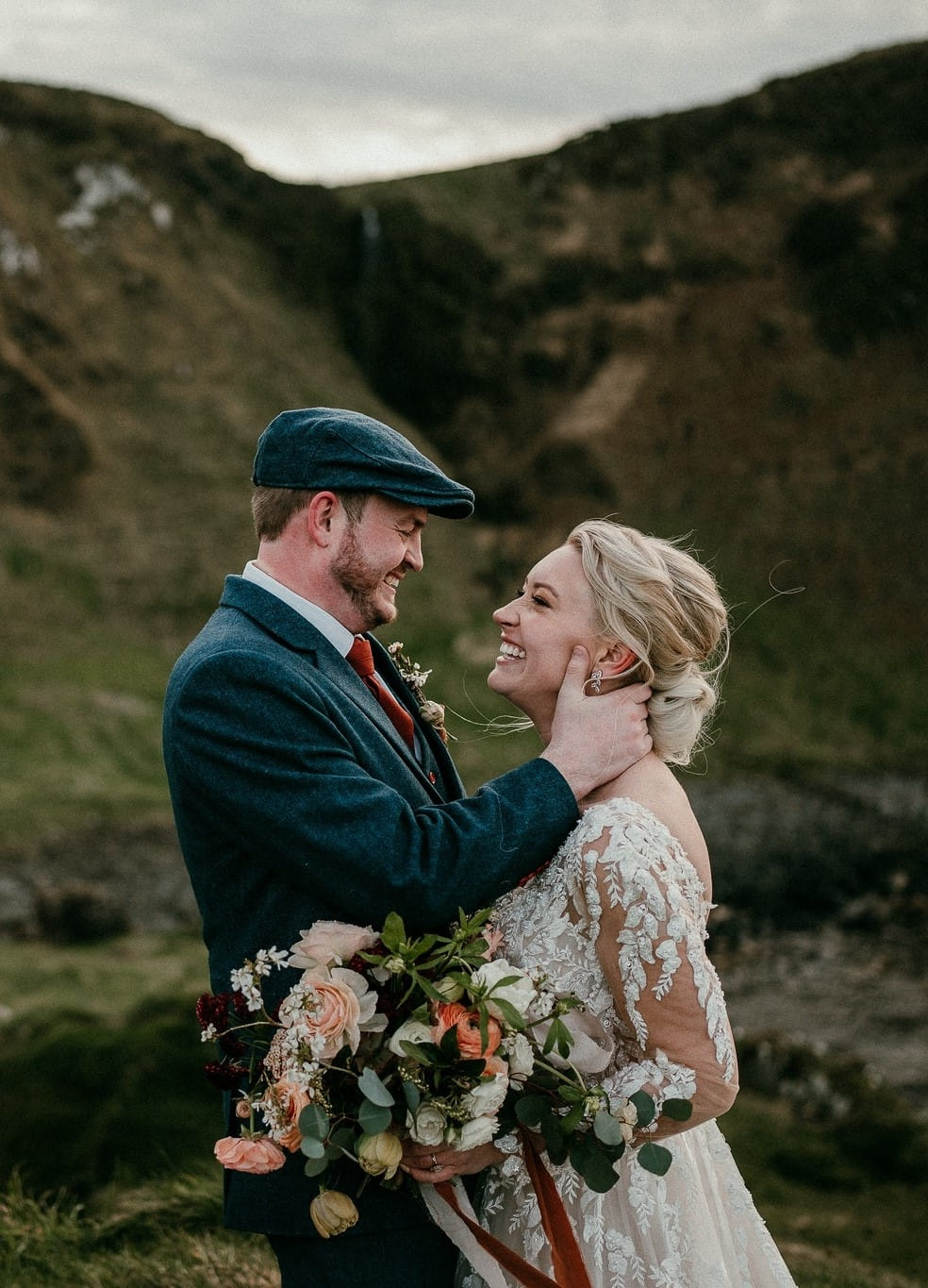 A picture of Laura and Ses laughing at their wedding